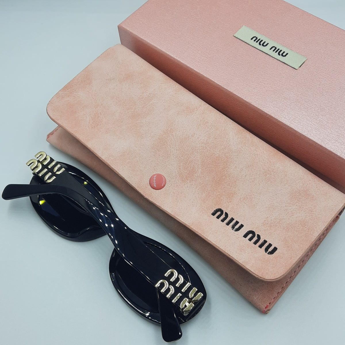 MIU MIU doré noir