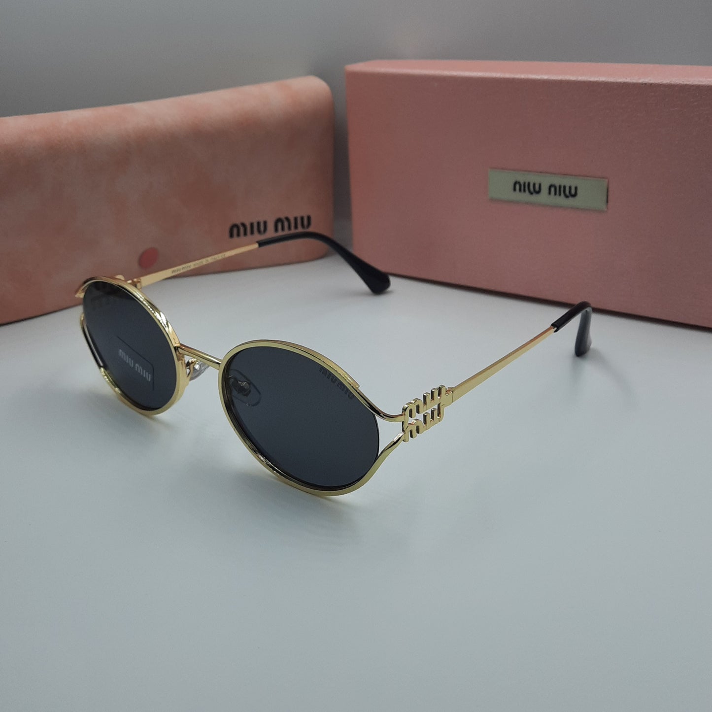 MIU MIU doré noir