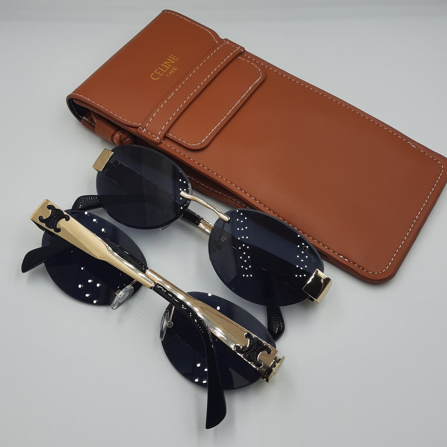 CELINE triomphe doré noir avec pochette à bandoulière