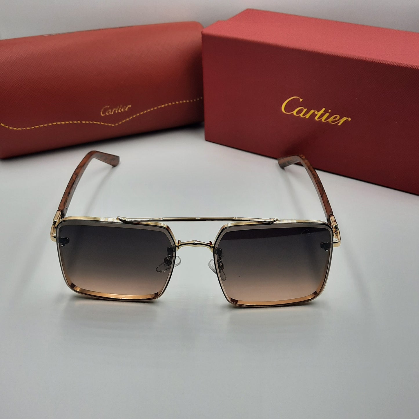 CARTIER doré marron