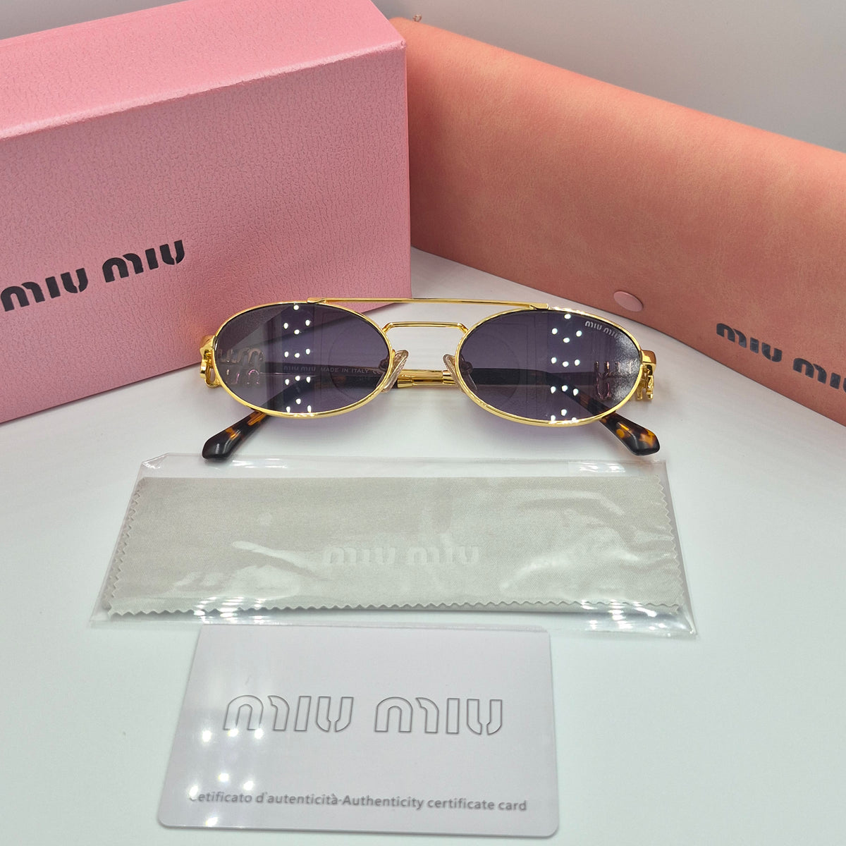 MIU MIU doré noir