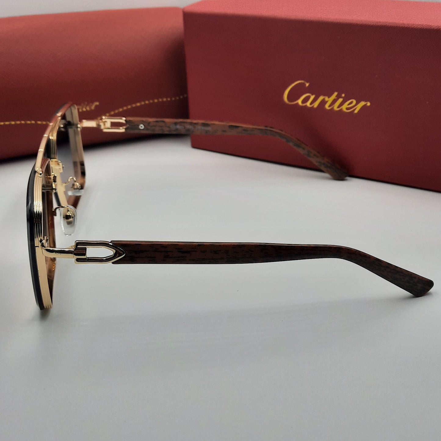 CARTIER doré marron