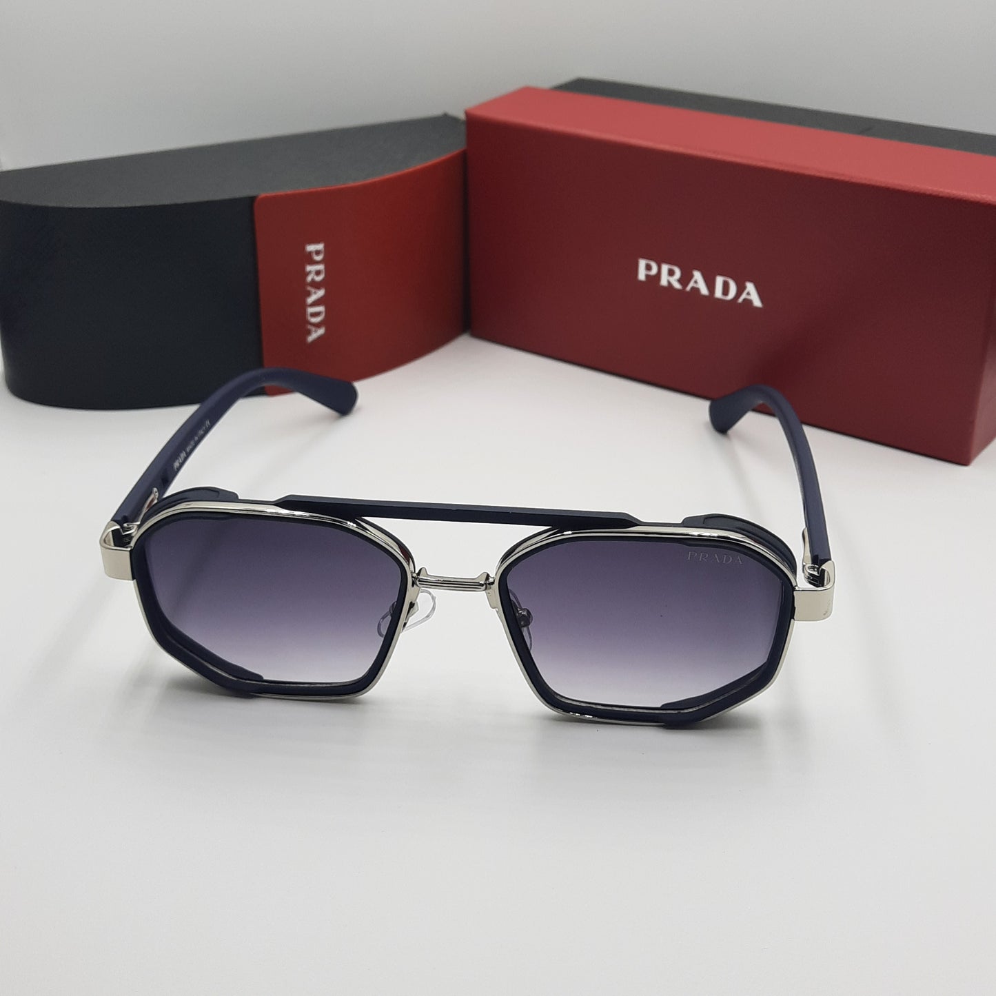 PRADA argent bleu rouge