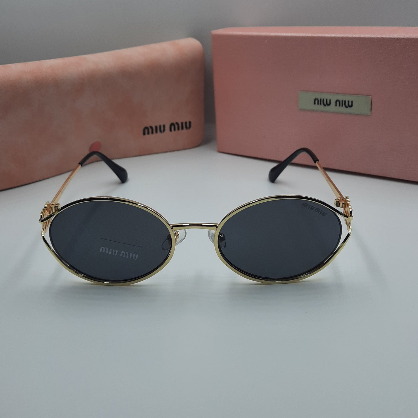 MIU MIU doré noir