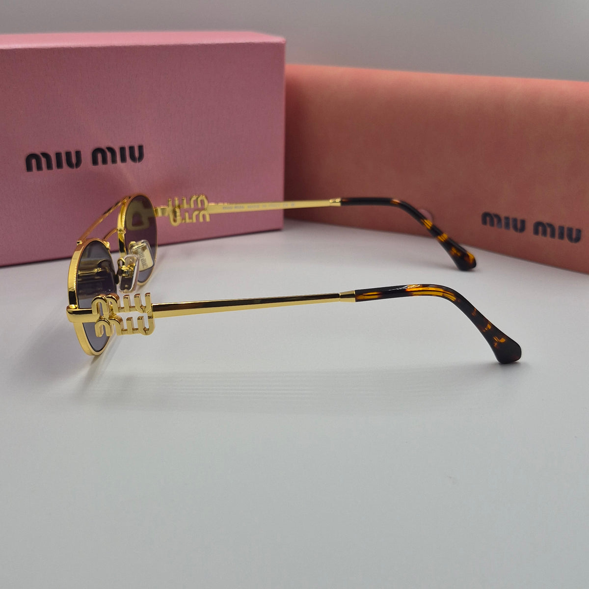 MIU MIU doré noir