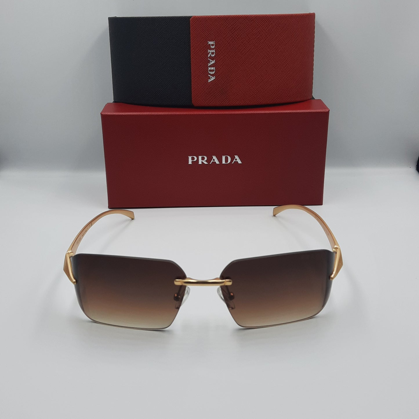 PRADA rimless doré marron