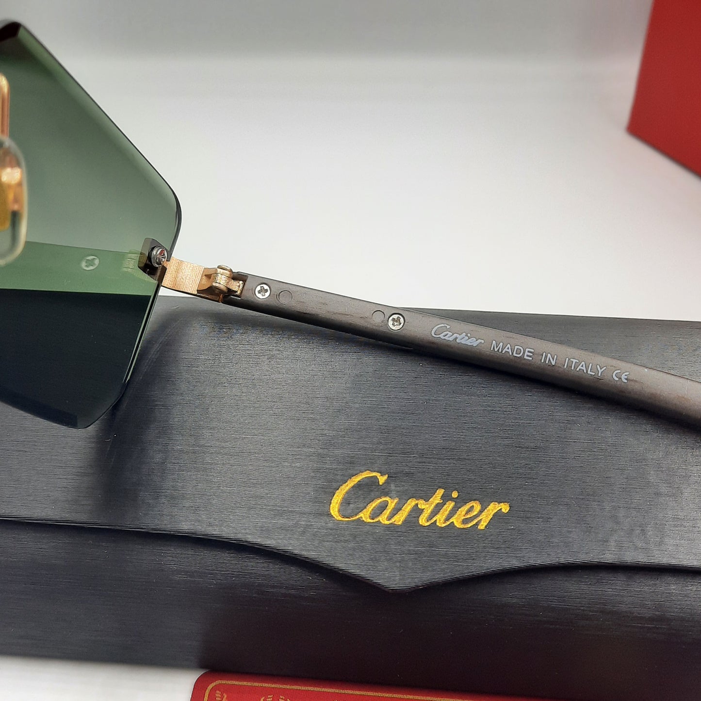 CARTIER rimless doré vert bois