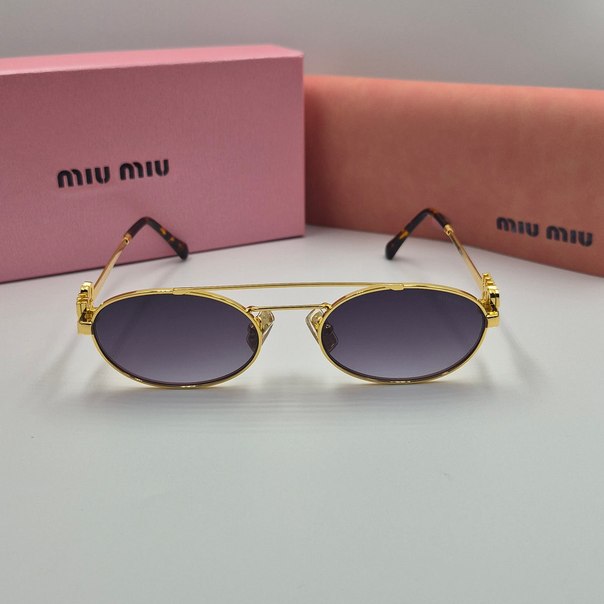 MIU MIU doré noir