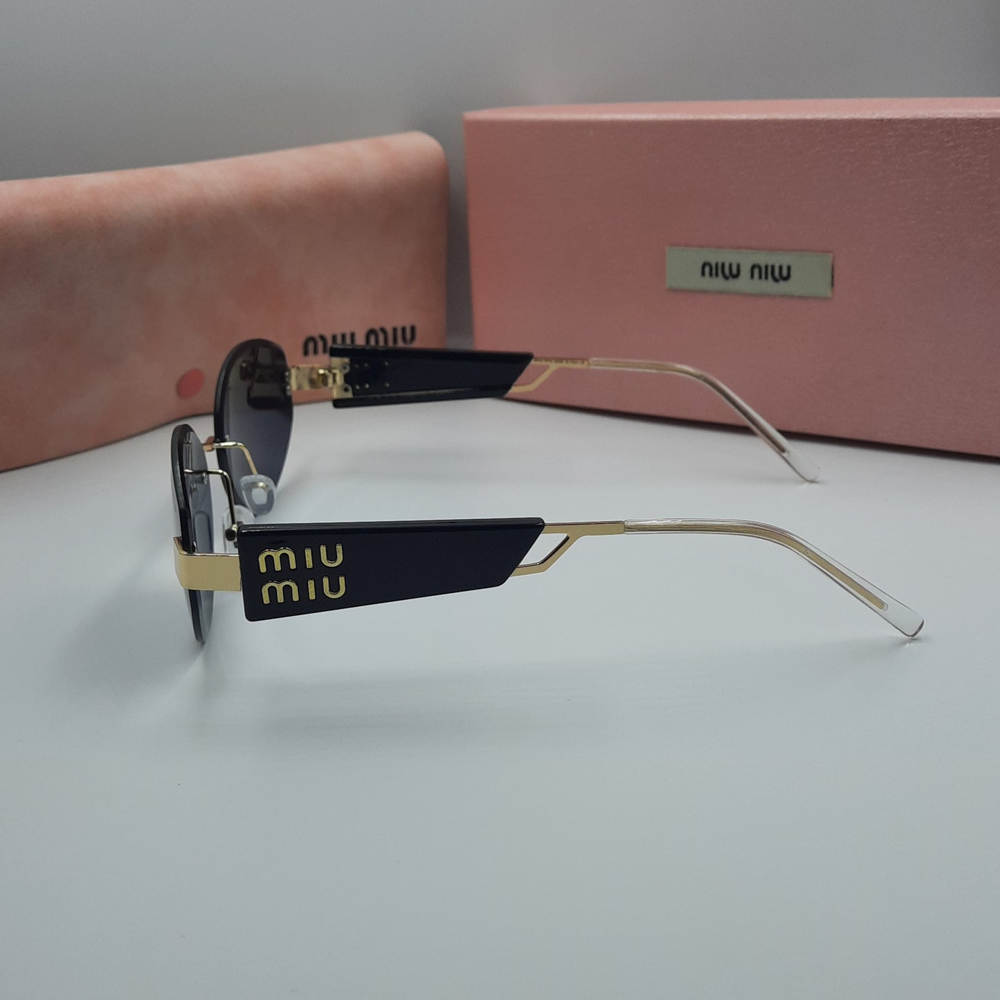 MIU MIU doré noir