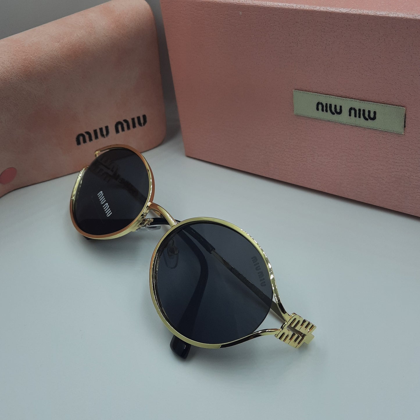 MIU MIU doré noir