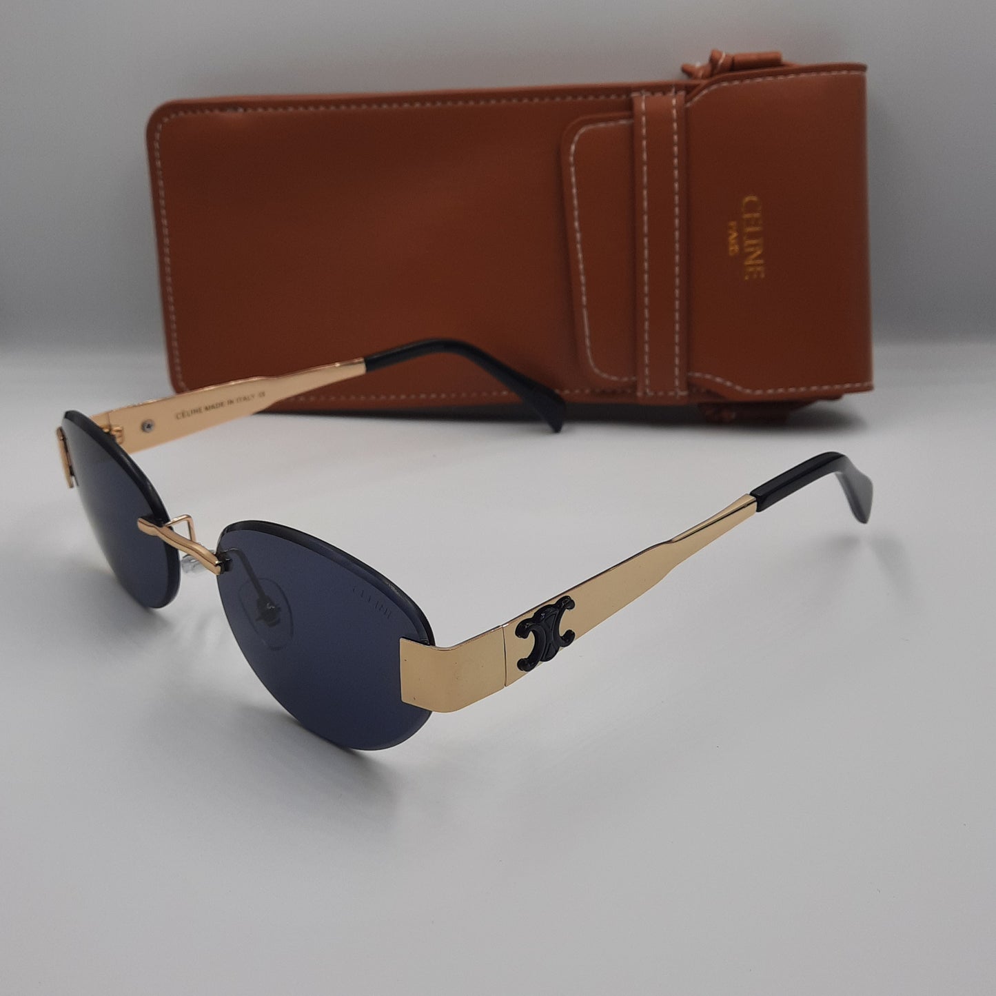 CELINE triomphe doré noir avec pochette à bandoulière