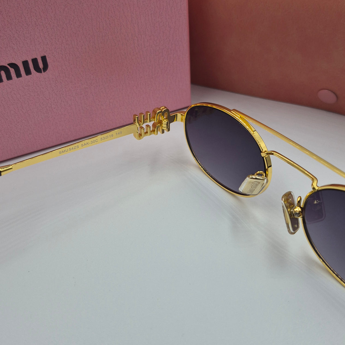 MIU MIU doré noir