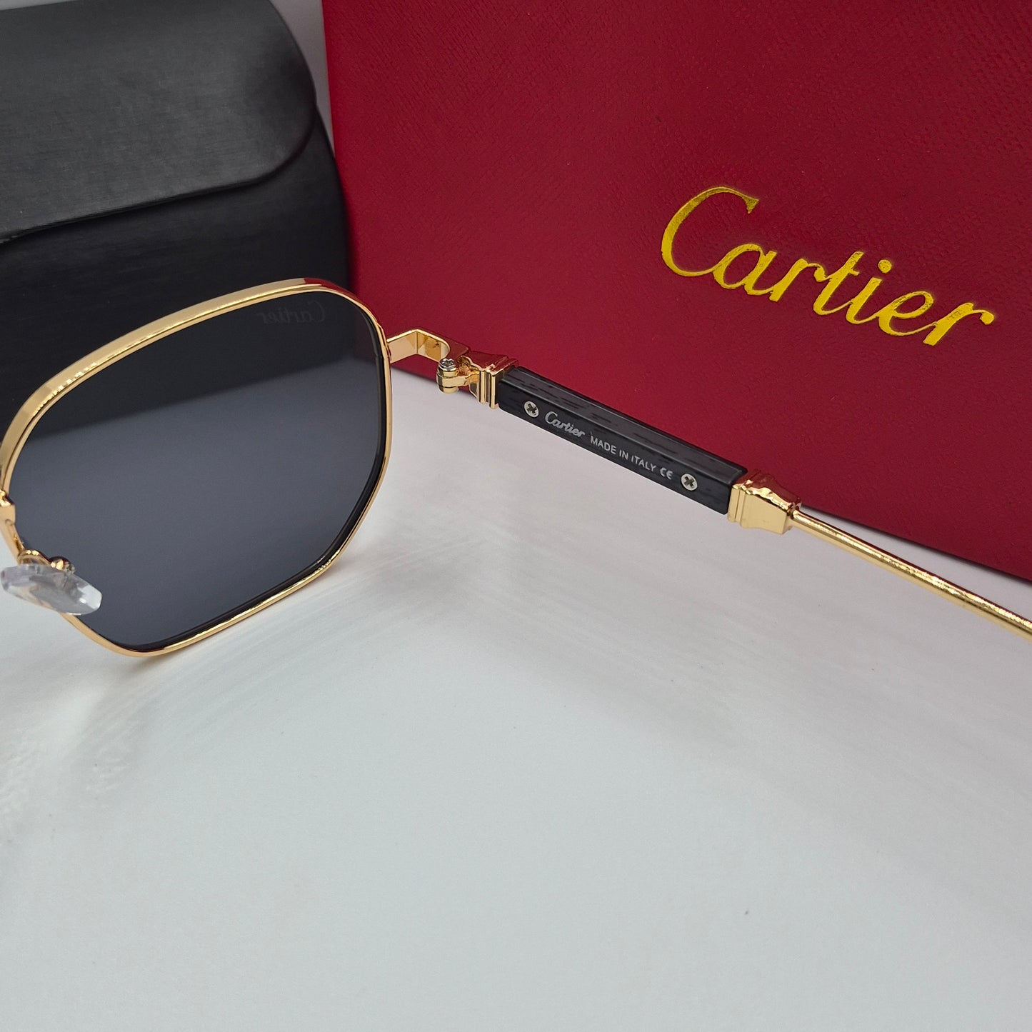 CARTIER luxe metal bois noir doré
