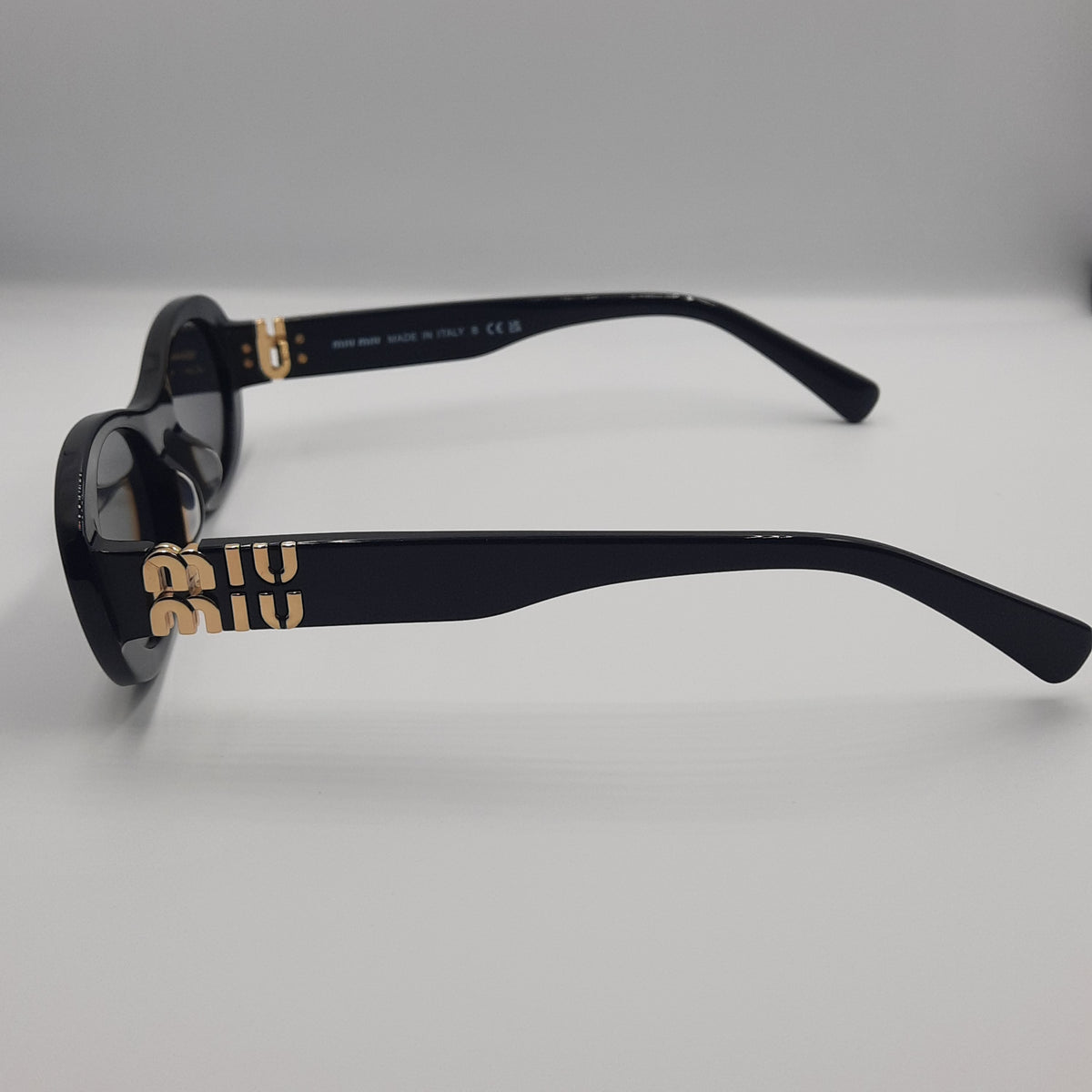 MIU MIU doré noir