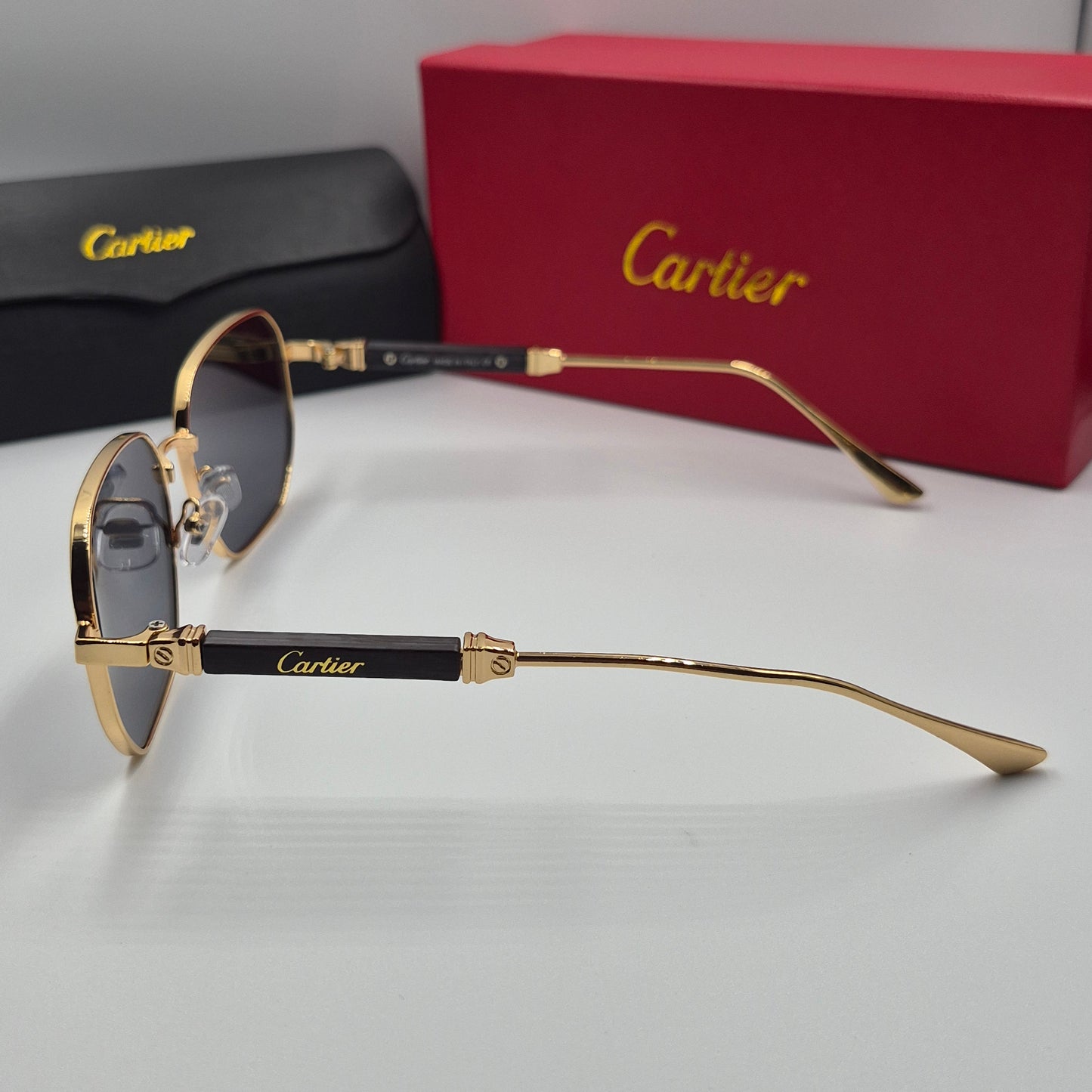 CARTIER luxe metal bois noir doré