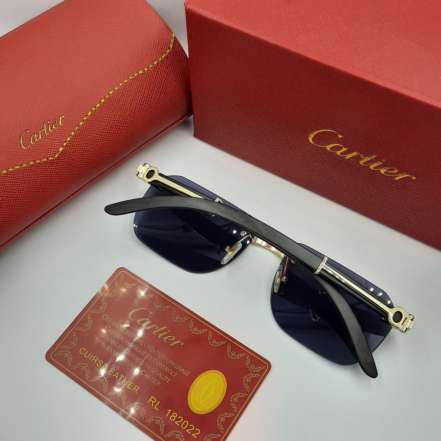 CARTIER rimless doré noir