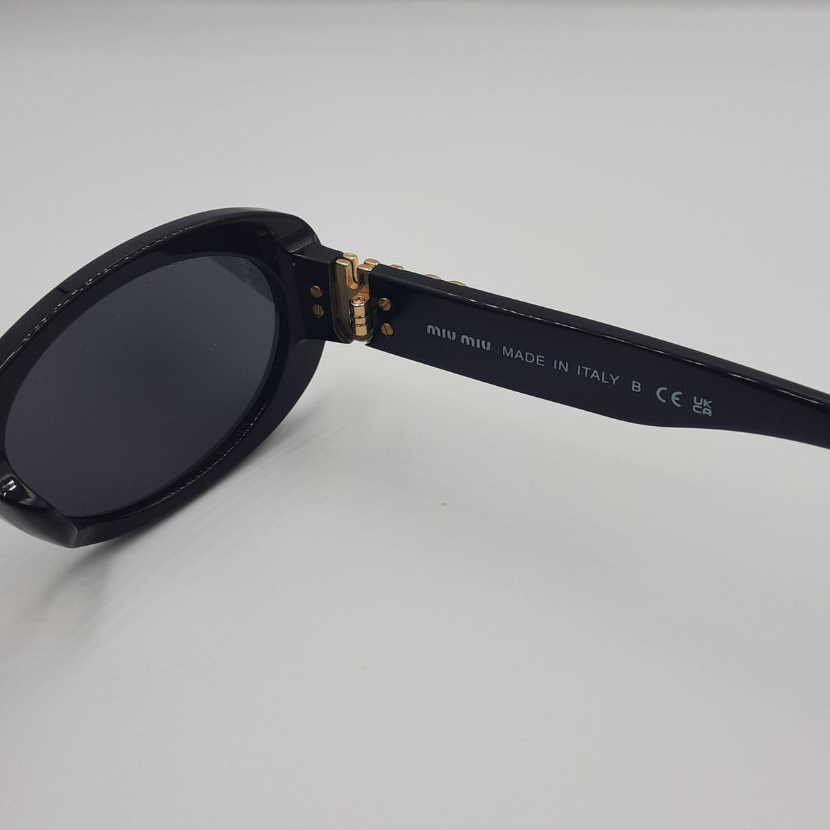 MIU MIU doré noir