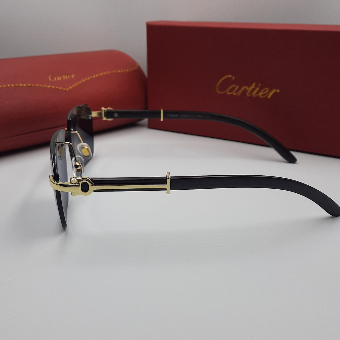 CARTIER rimless doré noir