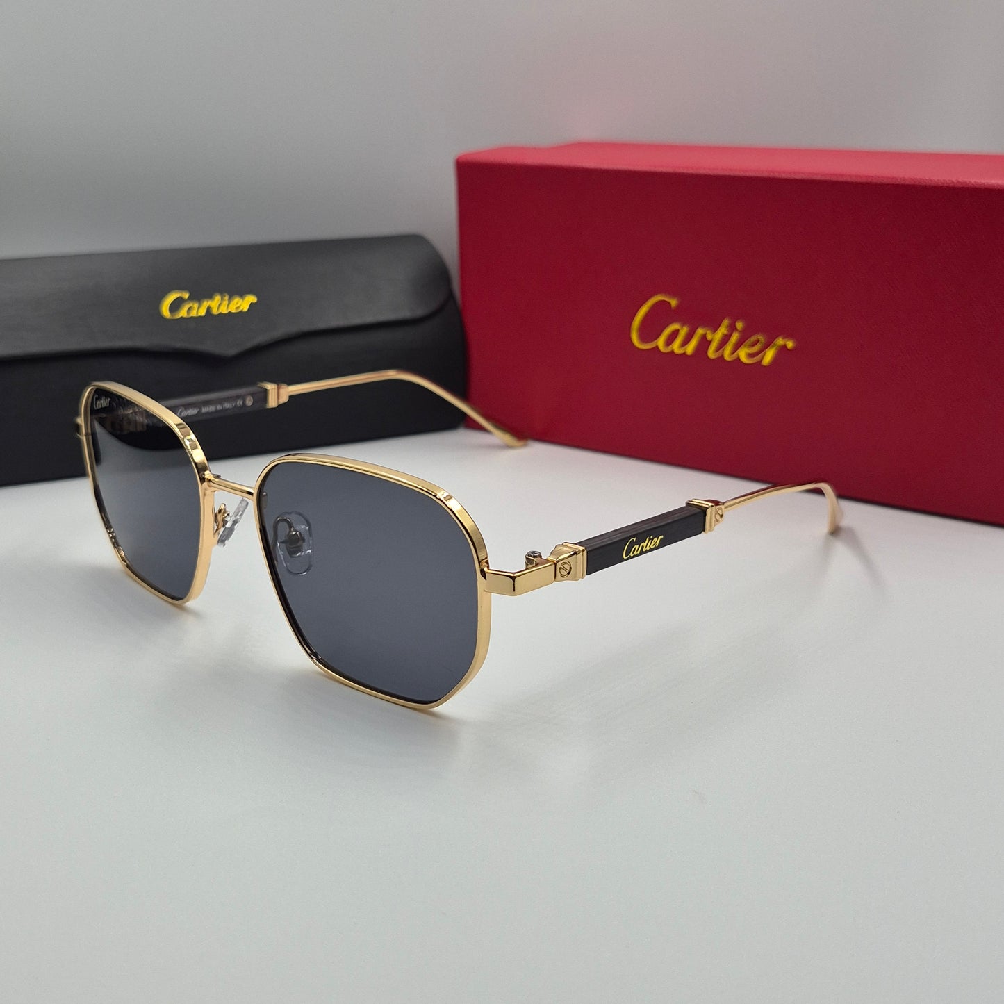 CARTIER luxe metal bois noir doré