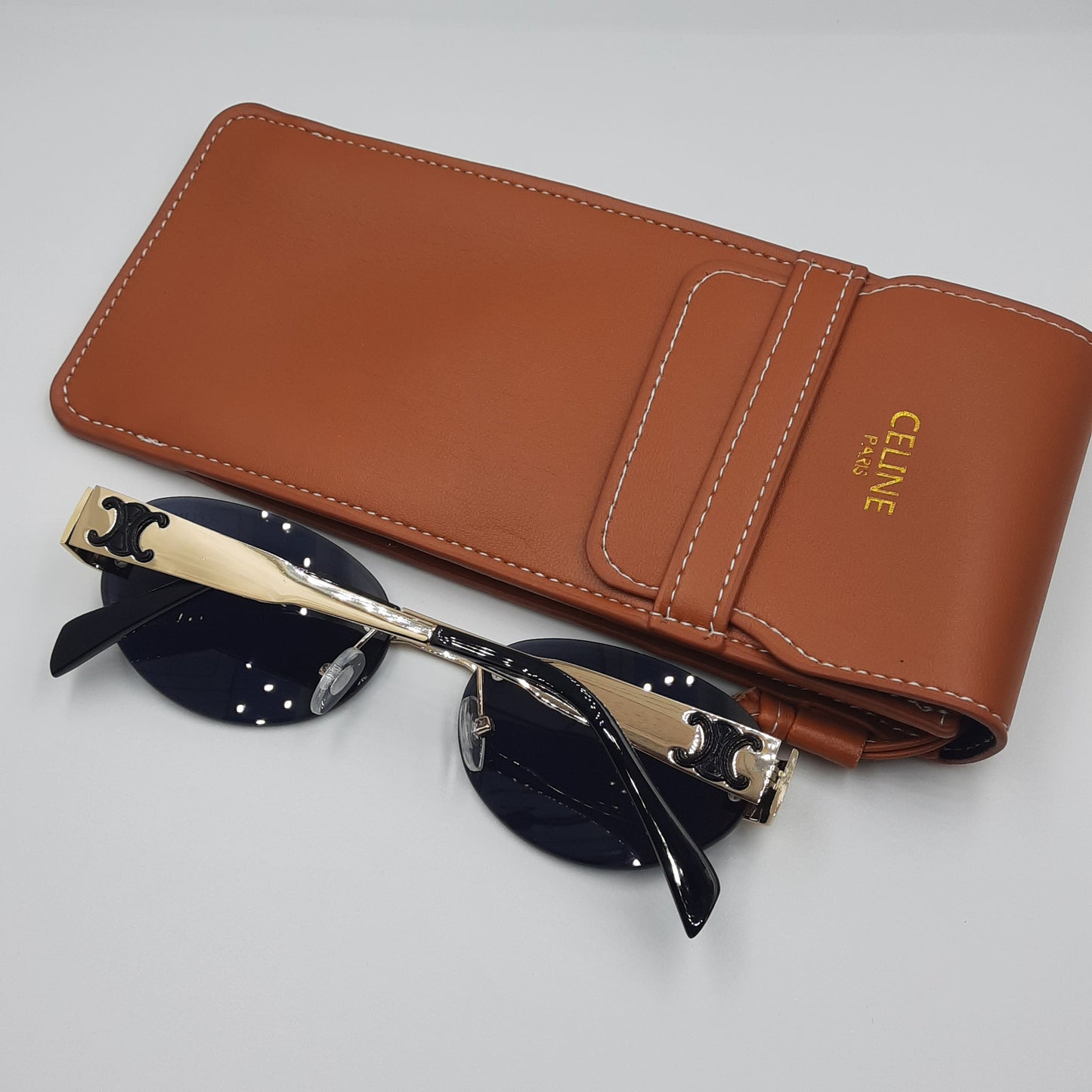 CELINE triomphe doré noir avec pochette à bandoulière