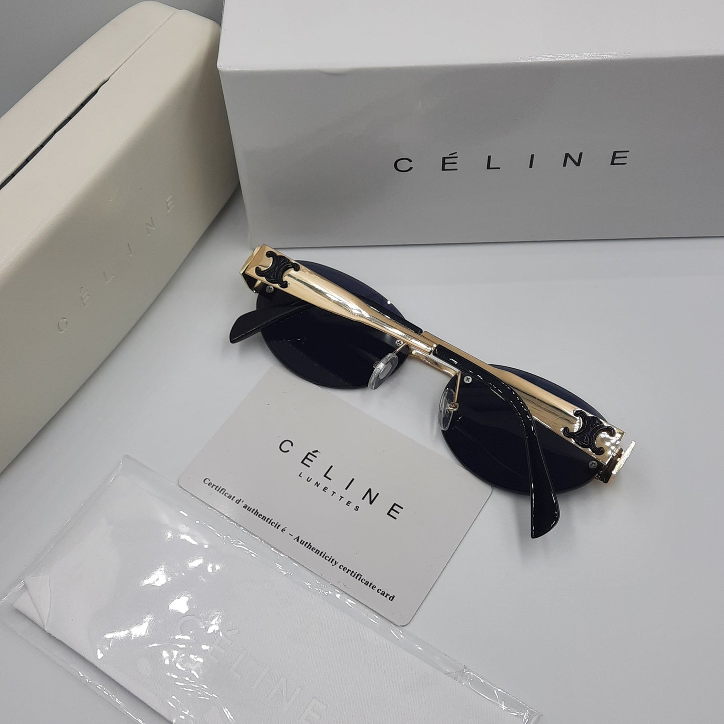 CELINE triomphe doré noir