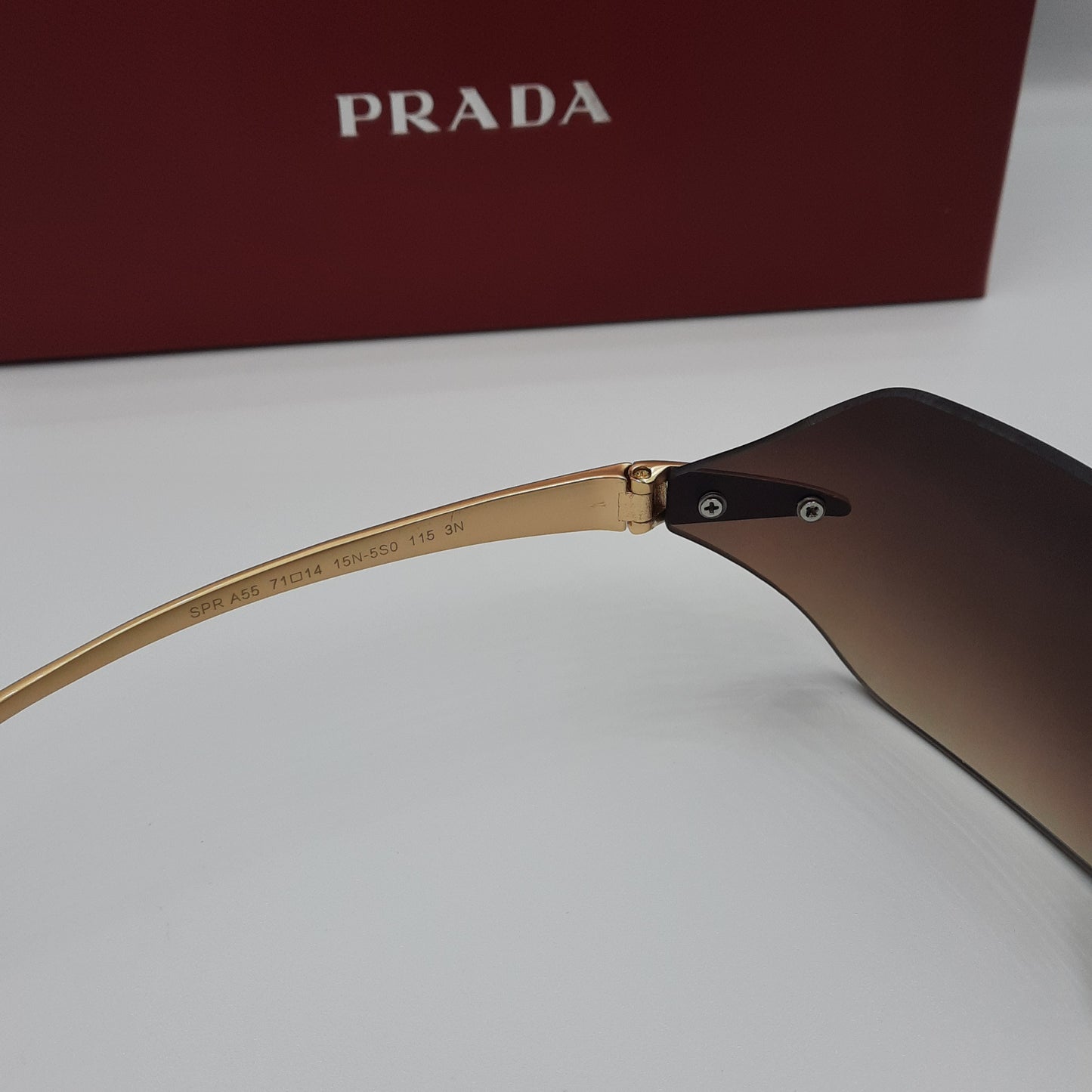 PRADA rimless doré marron