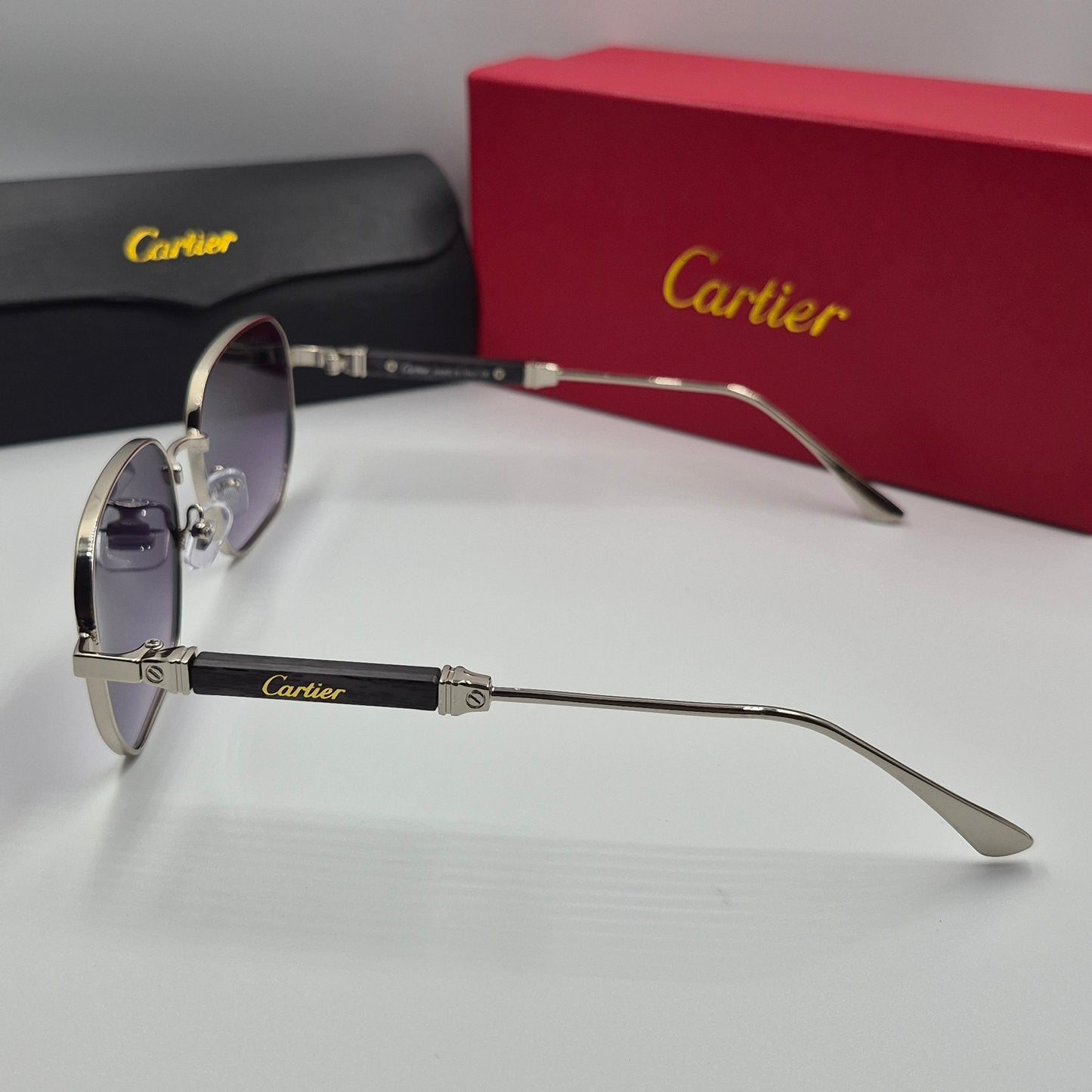 CARTIER luxe metal bois noir argent