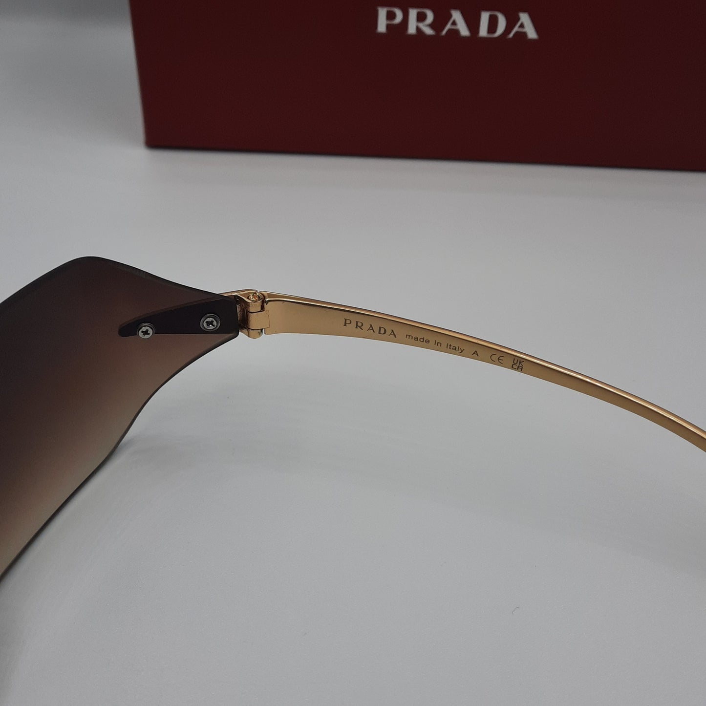 PRADA rimless doré marron