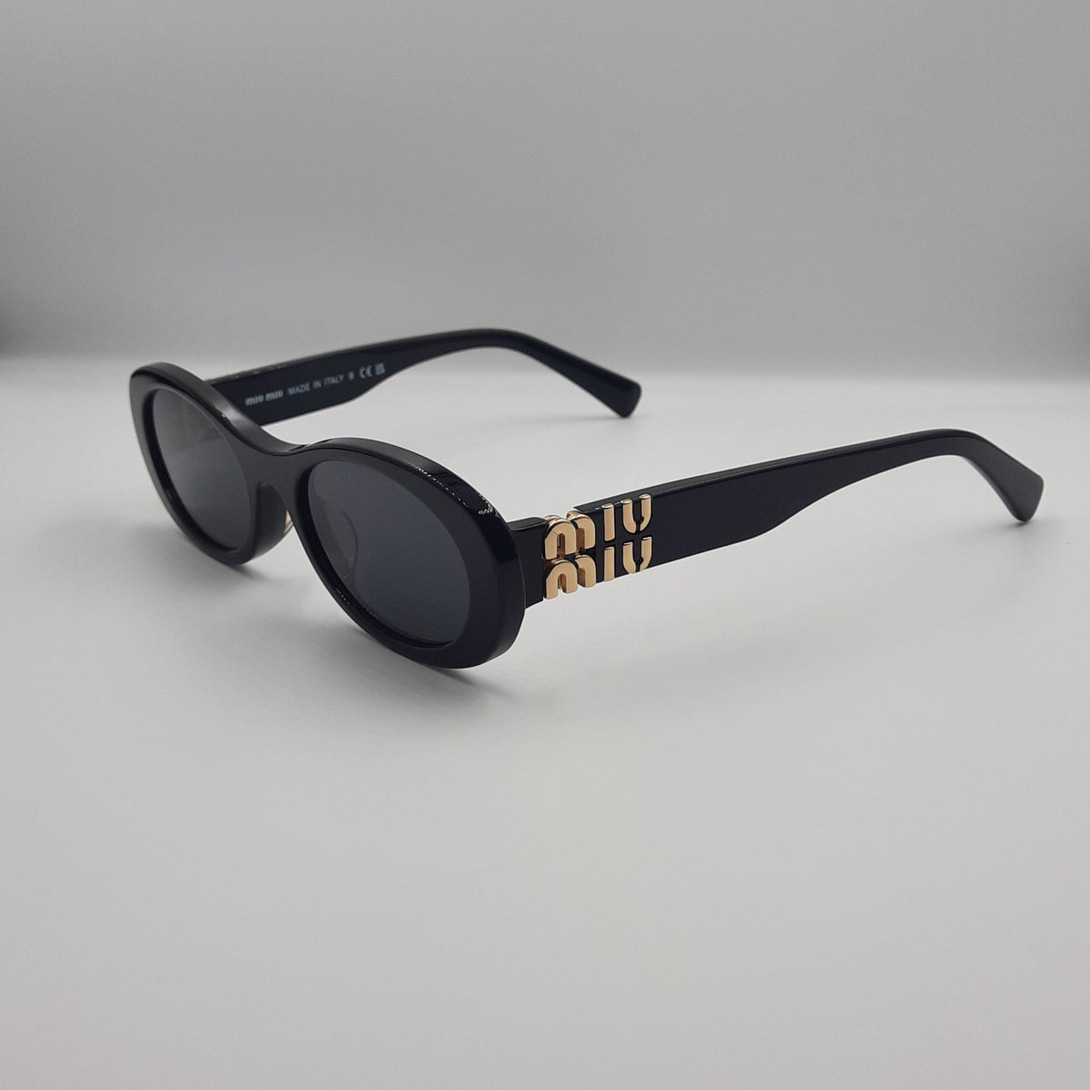 MIU MIU doré noir