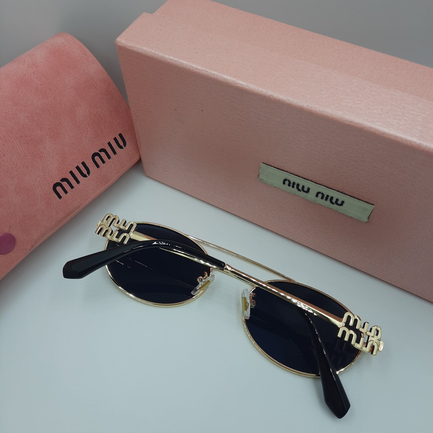 MIU MIU doré noir