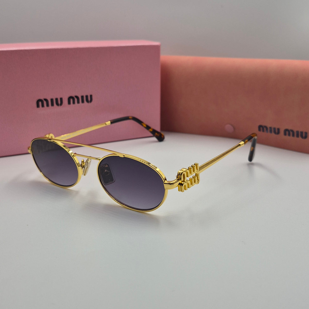 MIU MIU doré noir