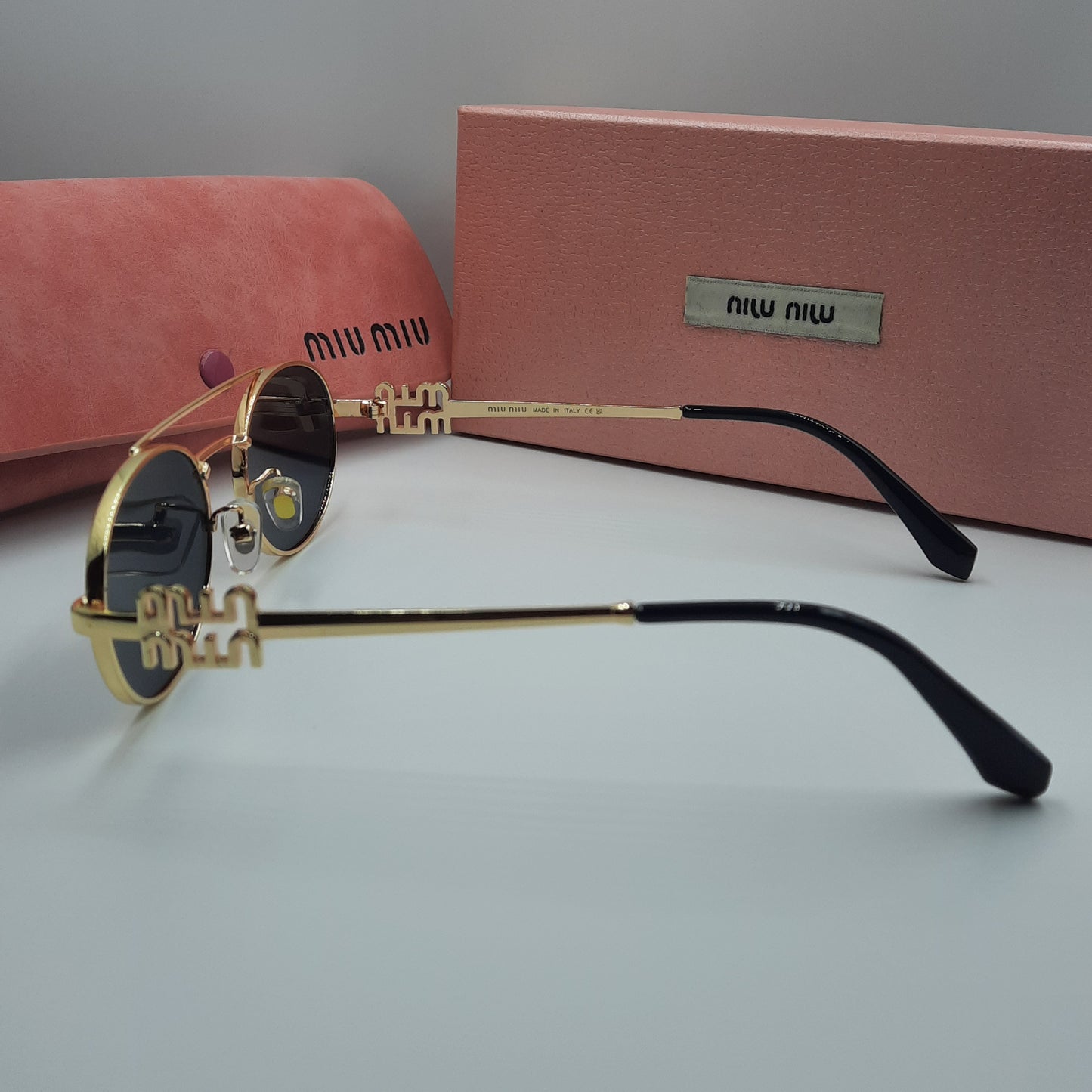 MIU MIU doré noir