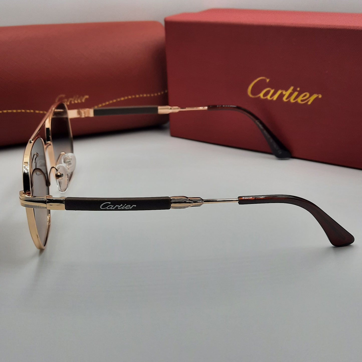 CARTIER doré marron