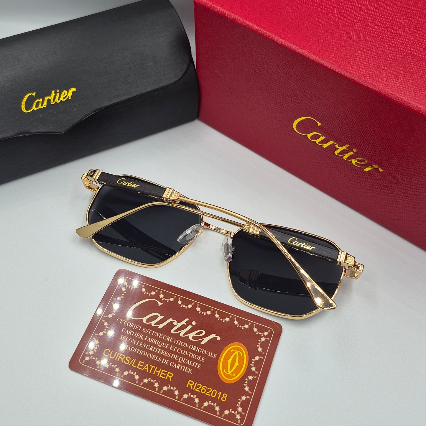 CARTIER luxe metal bois noir doré