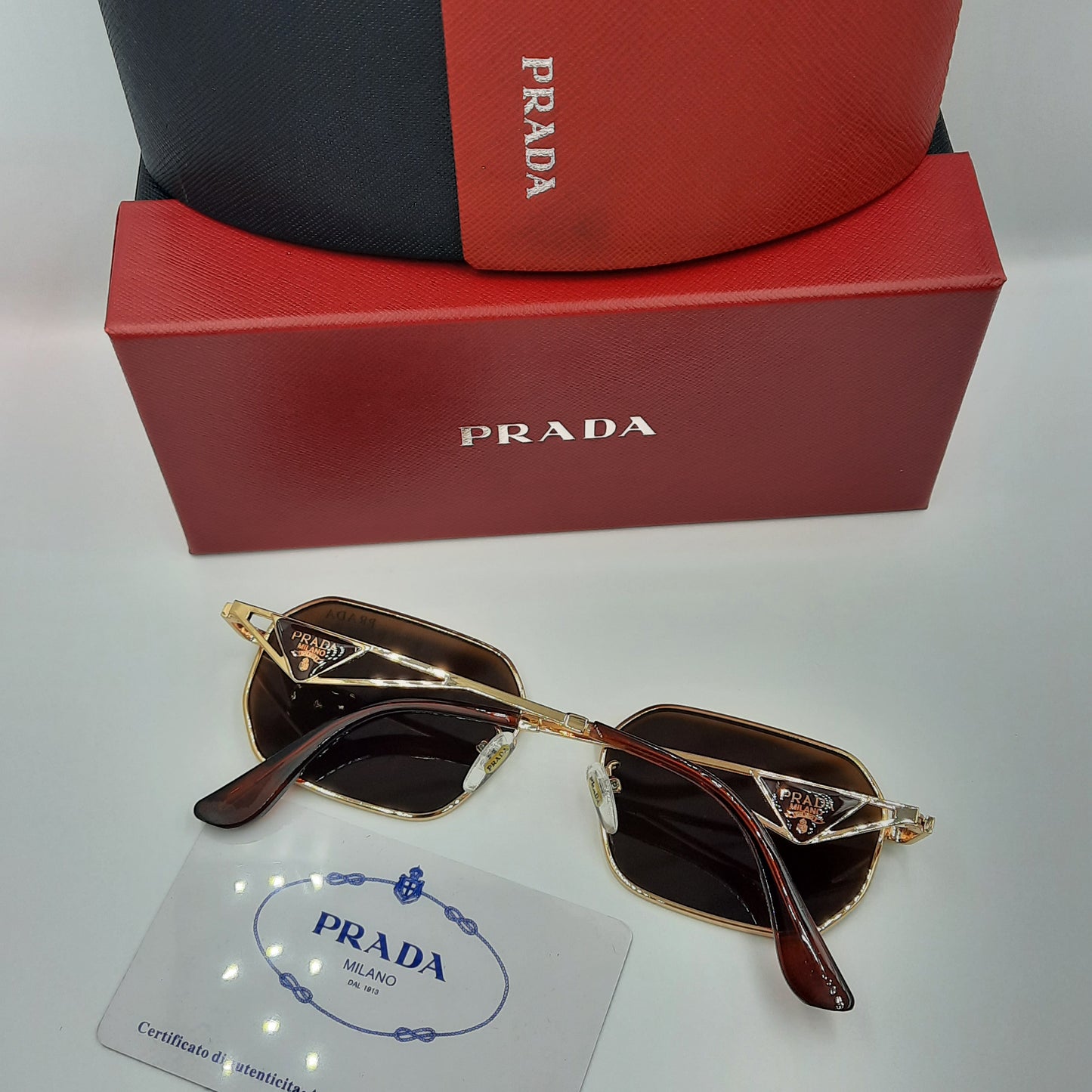 PRADA doré marron