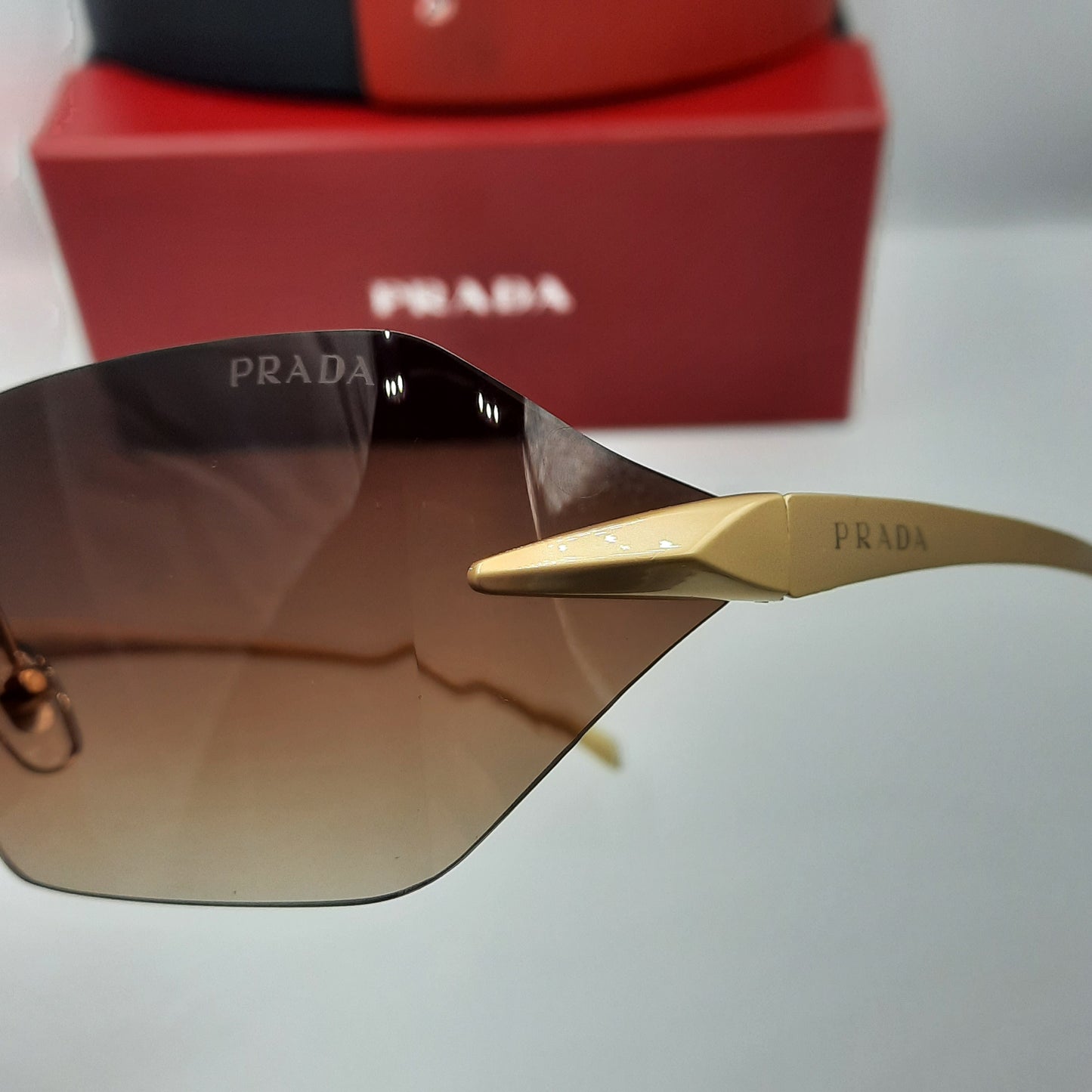 PRADA rimless doré marron