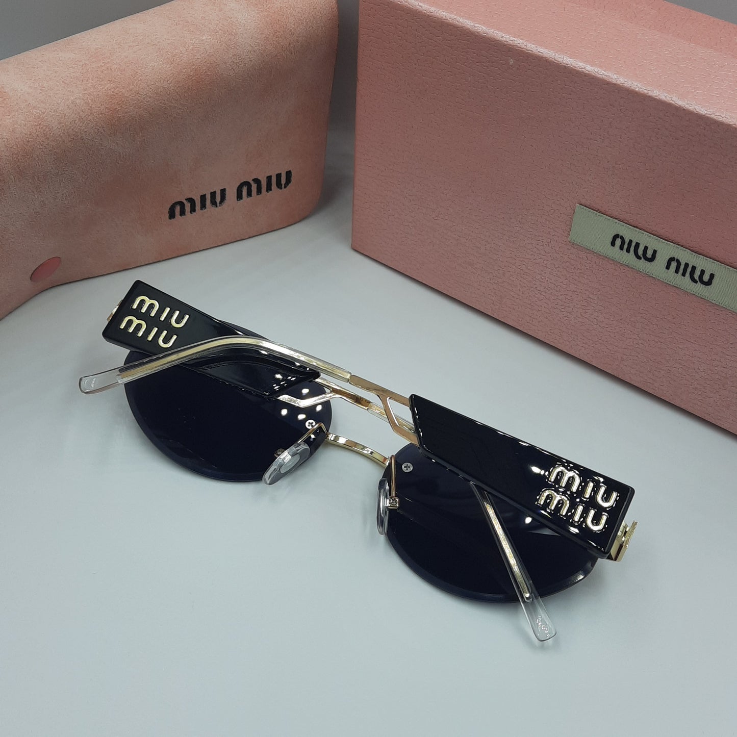 MIU MIU doré noir