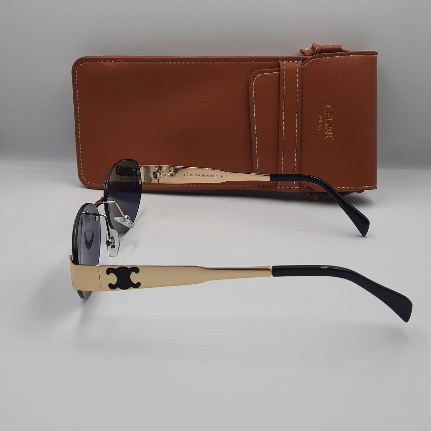 CELINE triomphe doré noir avec pochette à bandoulière