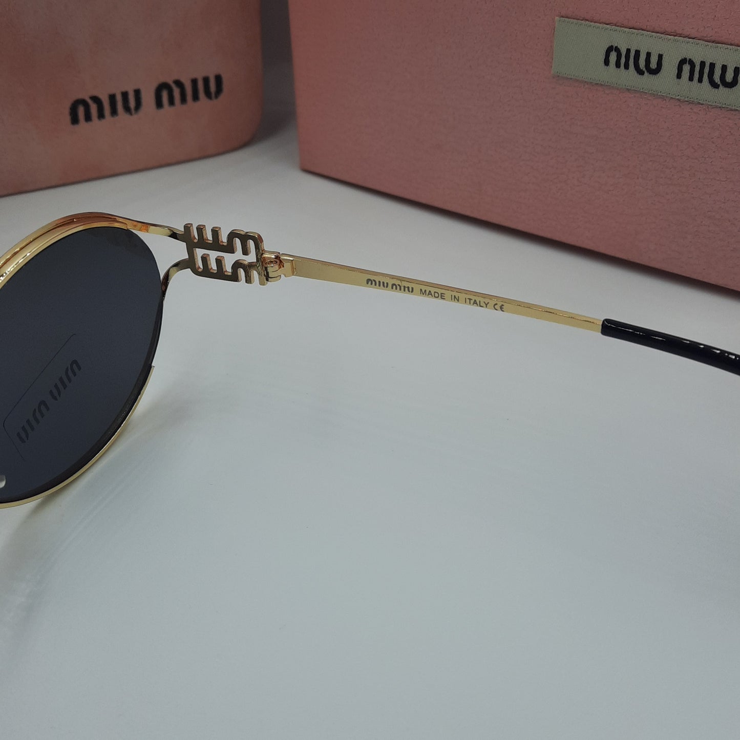 MIU MIU doré noir