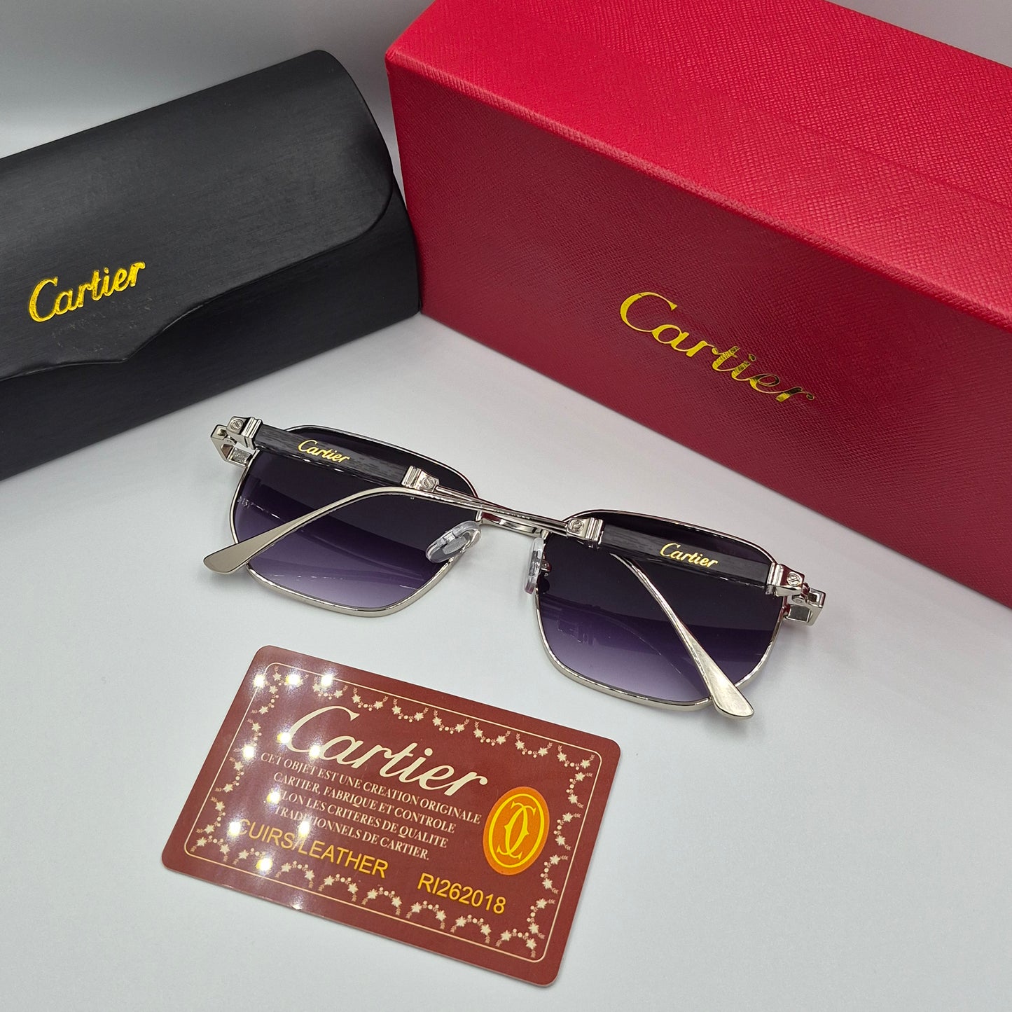 CARTIER luxe metal bois noir argent