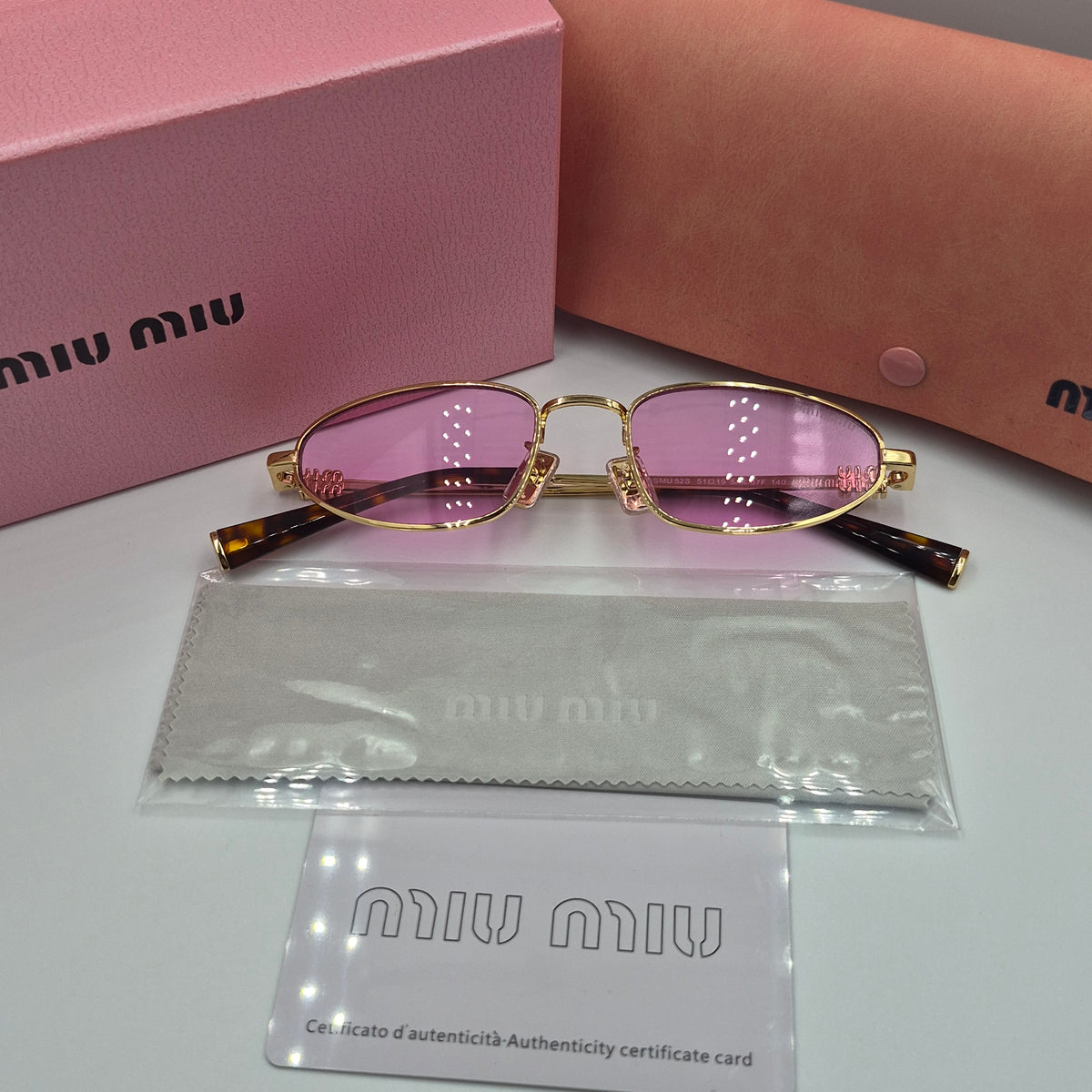 MIU MIU rose gold
